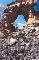 Walking through a rock arch